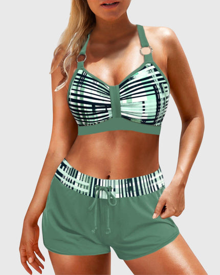 High-waisted geometric stripe bikini in green with navy stripes front angle view