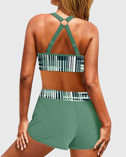 Back view of green high-waisted bikini with geometric stripe pattern and strappy design