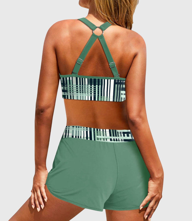 Back view of green high-waisted bikini with geometric stripe pattern and strappy design