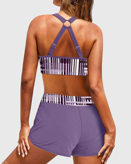 Back view of purple high-waisted bikini with geometric stripe pattern and strappy design