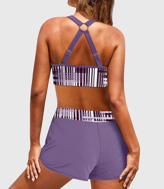 Back view of purple high-waisted bikini with geometric stripe pattern and strappy design