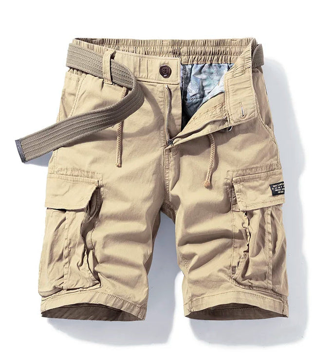 Beige cargo shorts with belt, multiple pockets, and knee-length cut