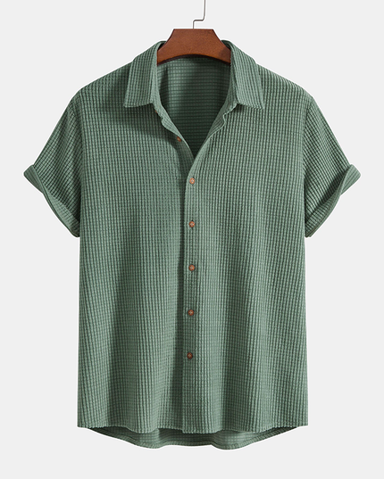 Sage green textured button-up shirt with rolled sleeves