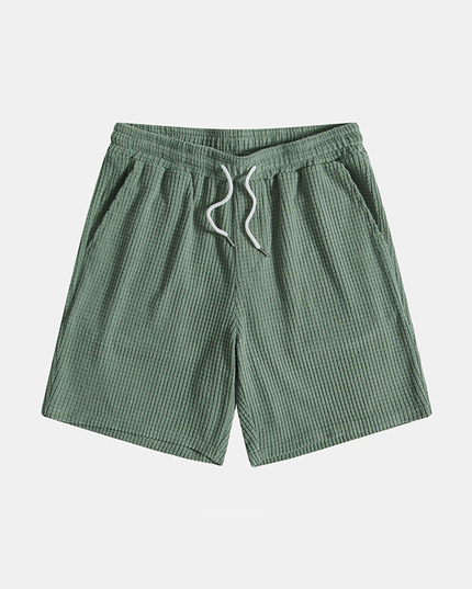 Sage green textured shorts with elastic waist and drawstring