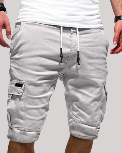 Light gray cargo shorts with drawstring, side cargo pockets, and rolled cuffs