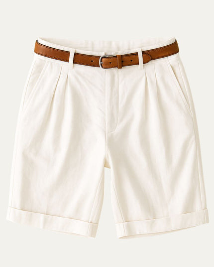Cream colored double pleat shorts with brown belt and rolled cuffs