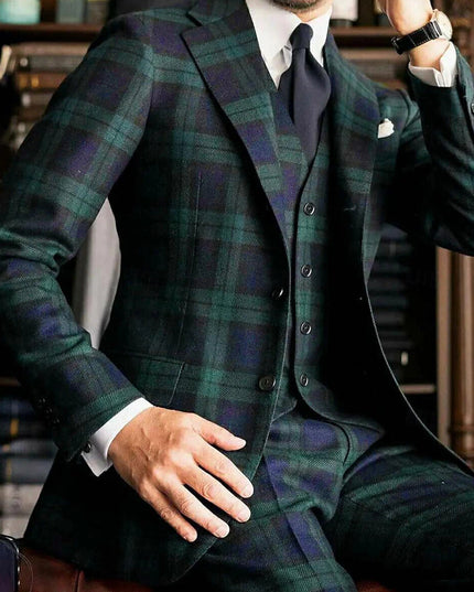 Close-up of tartan plaid formal suit jacket with button detail and white shirt cuff