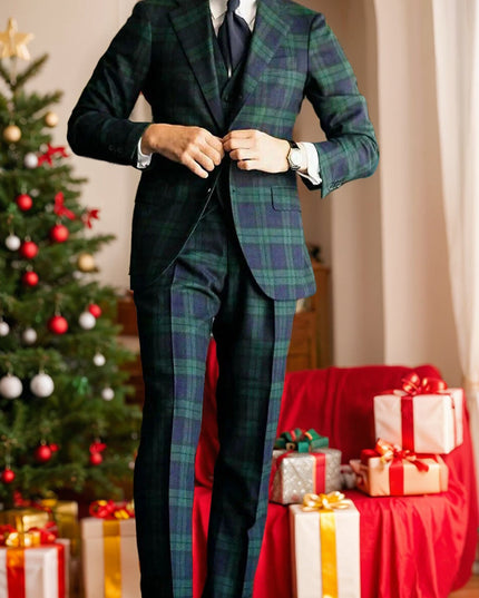 Men's tartan plaid formal suit styled with navy tie and white pocket square