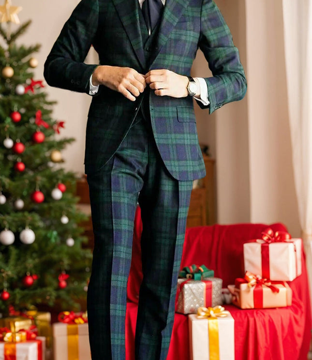 Men's tartan plaid formal suit styled with navy tie and white pocket square