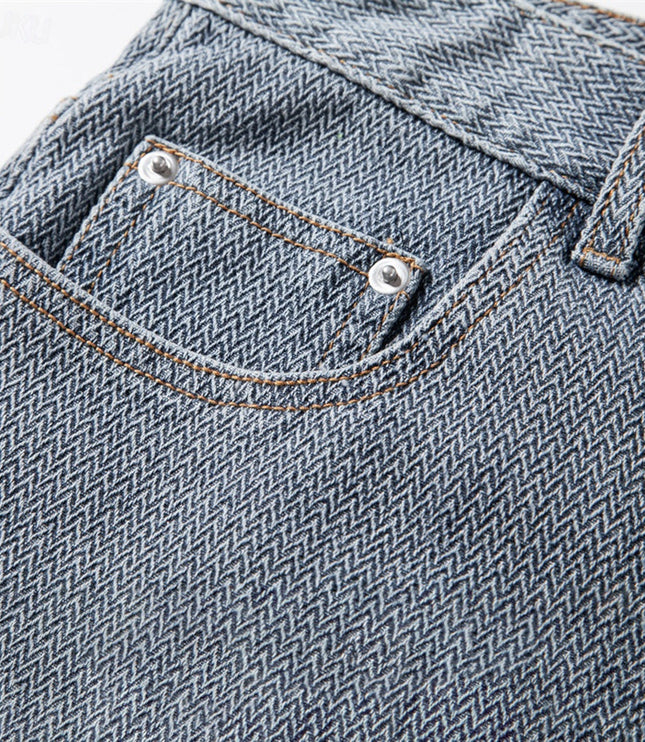 Macro detail of textured weave and stitching on denim shorts