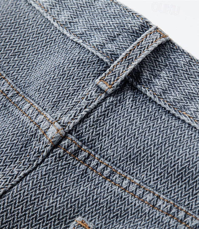 Rolled cuff detail on light blue denim shorts with contrast tan stitching