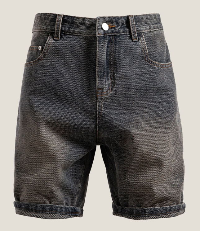 Front view of textured denim shorts with white button and rolled cuffs