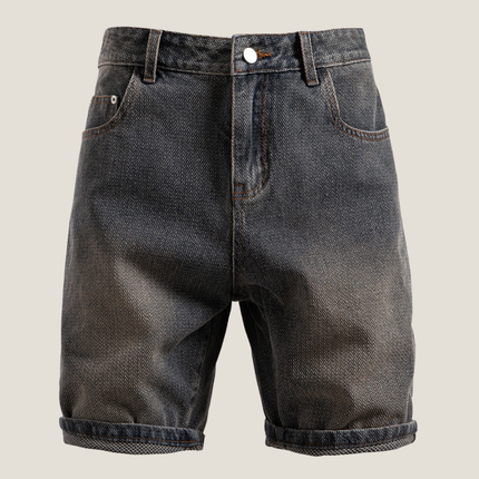 Front view of textured denim shorts with white button and rolled cuffs