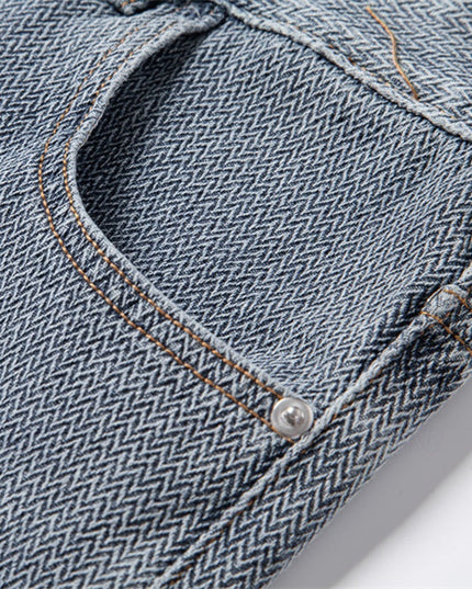 Detail shot of back pocket with contrast thread on denim shorts