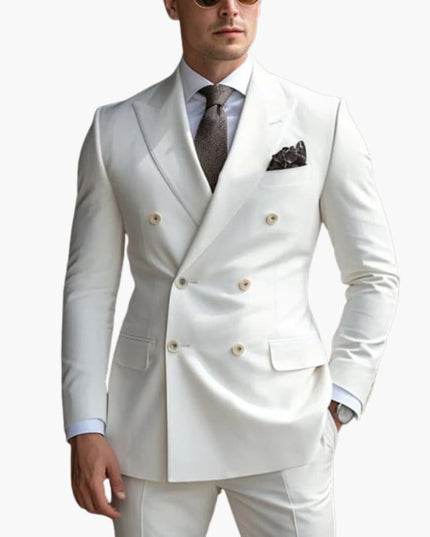 Cream double-breasted peak lapel formal suit with gray tie and patterned pocket square