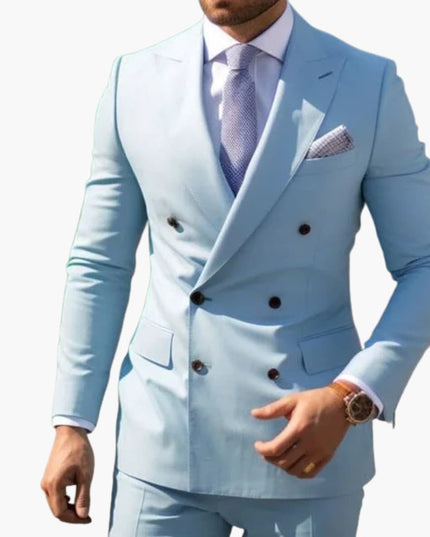 Light blue double-breasted peak lapel formal suit with dark tie and patterned pocket square