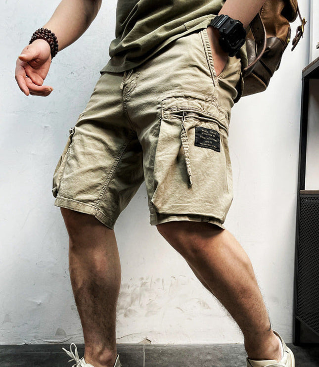 Khaki cargo shorts with drawstring waistband and multiple side pockets worn on model