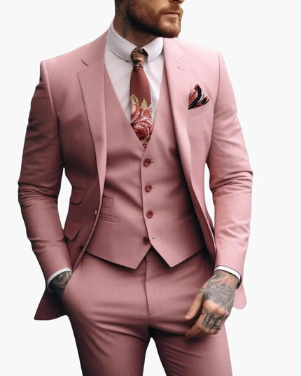 Men's dusty rose formal three-piece suit with tailored blazer, vest, and trousers