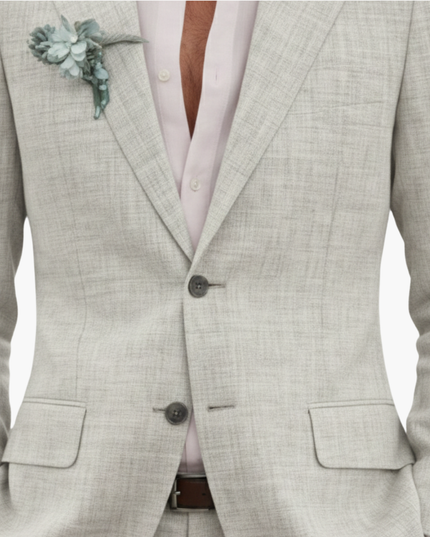 Cream linen blazer close-up showing notched lapel and button details