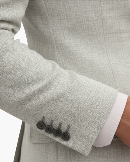 Beige linen jacket cuff detail with four-button sleeve and notched lapel