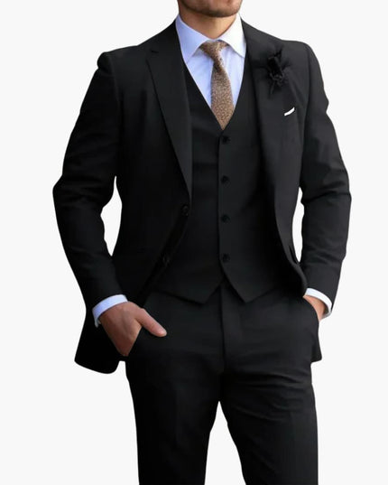 Black formal three piece suit with notched lapel jacket, vest, and trousers on model