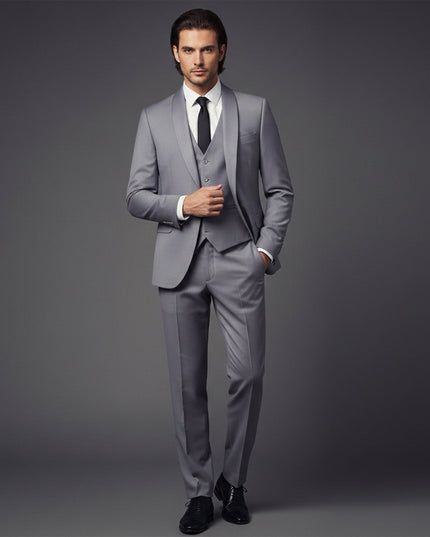 Gray formal tuxedo suit with vest worn with white dress shirt and black tie