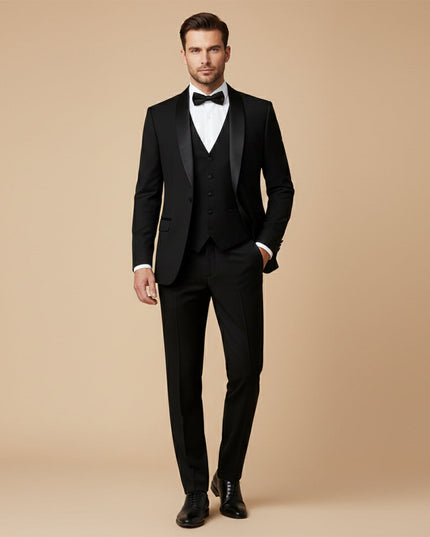 Black tuxedo suit worn with white dress shirt and black bow tie