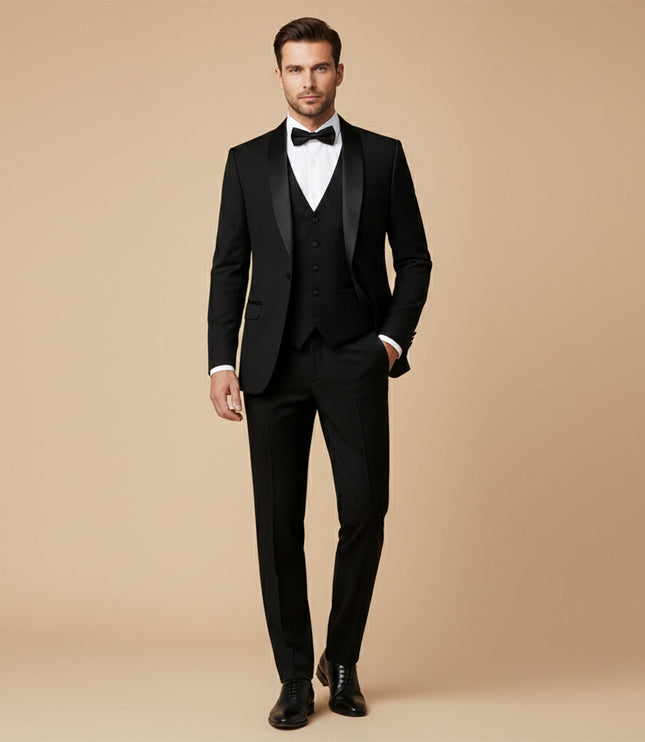 Black tuxedo suit worn with white dress shirt and black bow tie