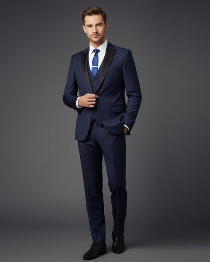 Navy tuxedo suit styled with white shirt and blue tie