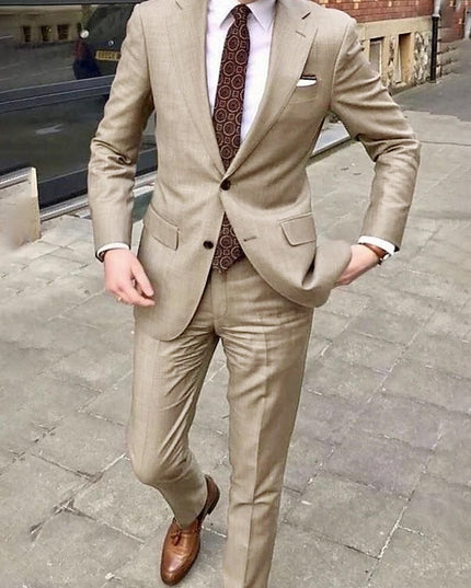 Beige single breasted two button formal suit with notch lapel, paired with burgundy patterned tie