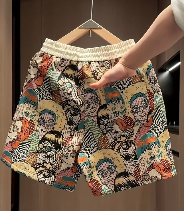 Wide leg shorts with cream waistband and all-over graphic print in orange, teal, and black