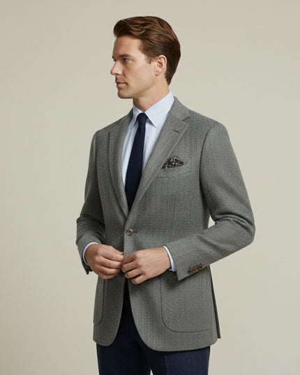 Gray herringbone tweed blazer side profile with notched lapels and cuff buttons
