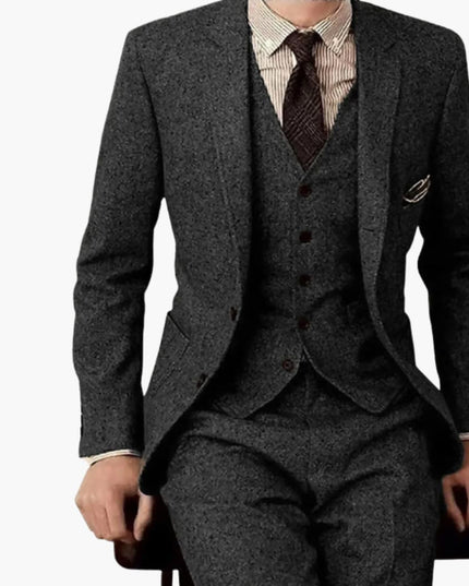 Charcoal gray herringbone tweed formal suit with notch lapel and tailored trousers for men