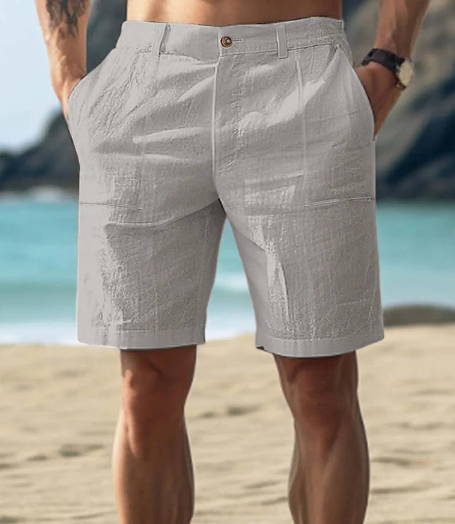 Light gray men's linen flat front shorts with knee length fit and side pockets