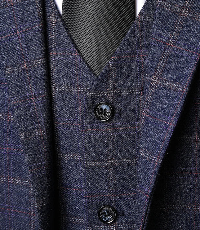 Detailed view of navy plaid vest showing texture and button closure