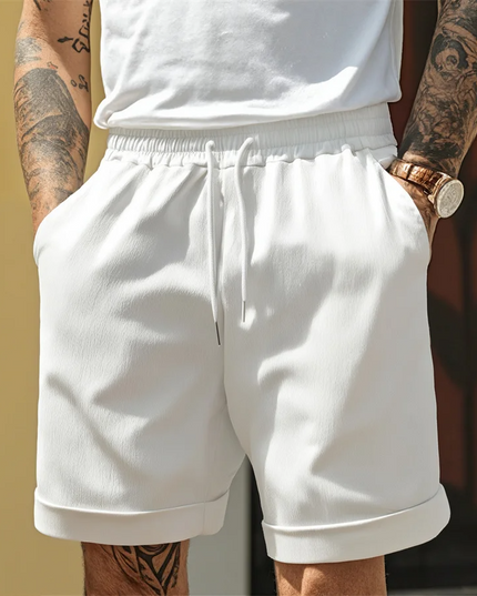 White relaxed pull-on shorts with drawstring and folded turnup hem