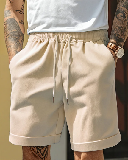 Beige relaxed pull-on shorts with drawstring and contrast turnup cuff