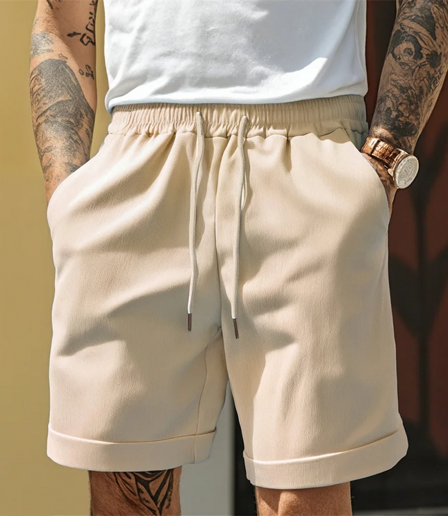Beige relaxed pull-on shorts with drawstring and contrast turnup cuff