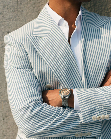 Close-up of blue and white striped seersucker suit jacket with white dress shirt