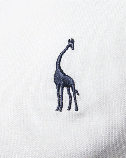White polo shirt with navy giraffe embroidery detail on chest