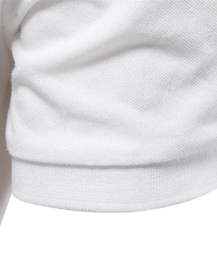 Close-up of white polo shirt ribbed collar and short sleeve cuff detail