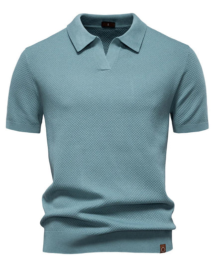 Slate blue textured short sleeve polo shirt with ribbed collar and cuffs
