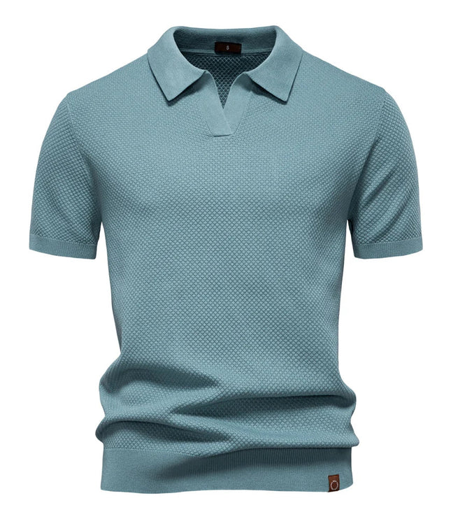 Slate blue textured short sleeve polo shirt with ribbed collar and cuffs