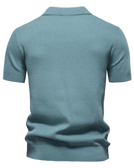 Back view of slate blue polo shirt showing textured knit pattern and short sleeves