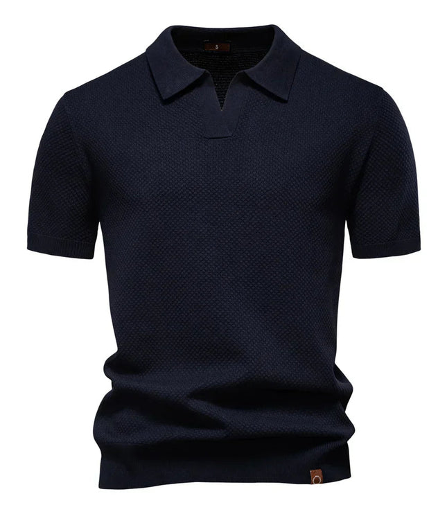 Navy blue textured polo shirt with short sleeves and collar
