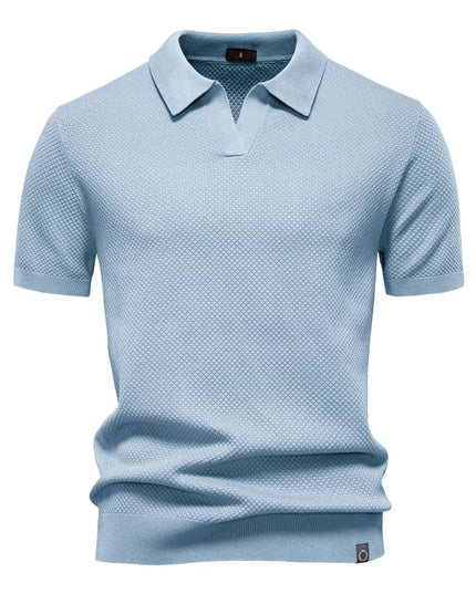 Light blue textured polo shirt with short sleeves and collar detail