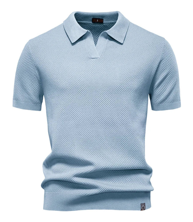 Light blue textured polo shirt with short sleeves and collar detail