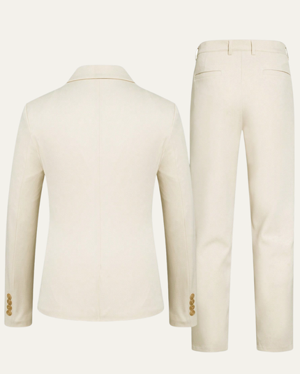 Back view of cream tailored suit blazer with gold cuff buttons and dress slacks