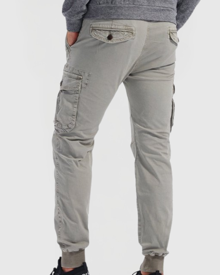 Back view of gray men's cargo pants with flap pockets and tapered fit