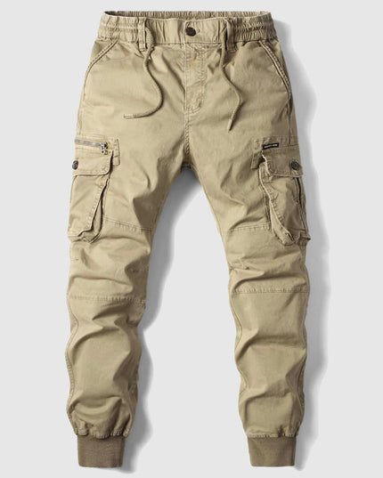 Beige men's cargo pants with multiple pockets and elastic waistband detail